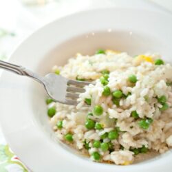 Creamy cauliflower rice with green peas, healthy vegetable side dish, Baked Bree recipe.