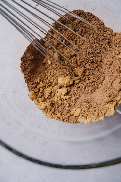 Finely ground cocoa powder and sugar mixture for baking batter.