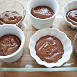 Silky smooth chocolate pudding in white and clear ramekins. Perfect for desserts or snacks, made easily at home.