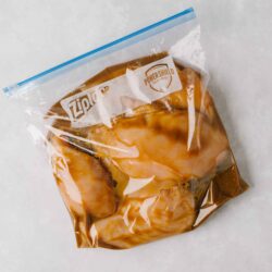 Ziploc storage bag filled with marinated chicken breasts for baking or grilling, featuring Power Shield technology for freshness.
