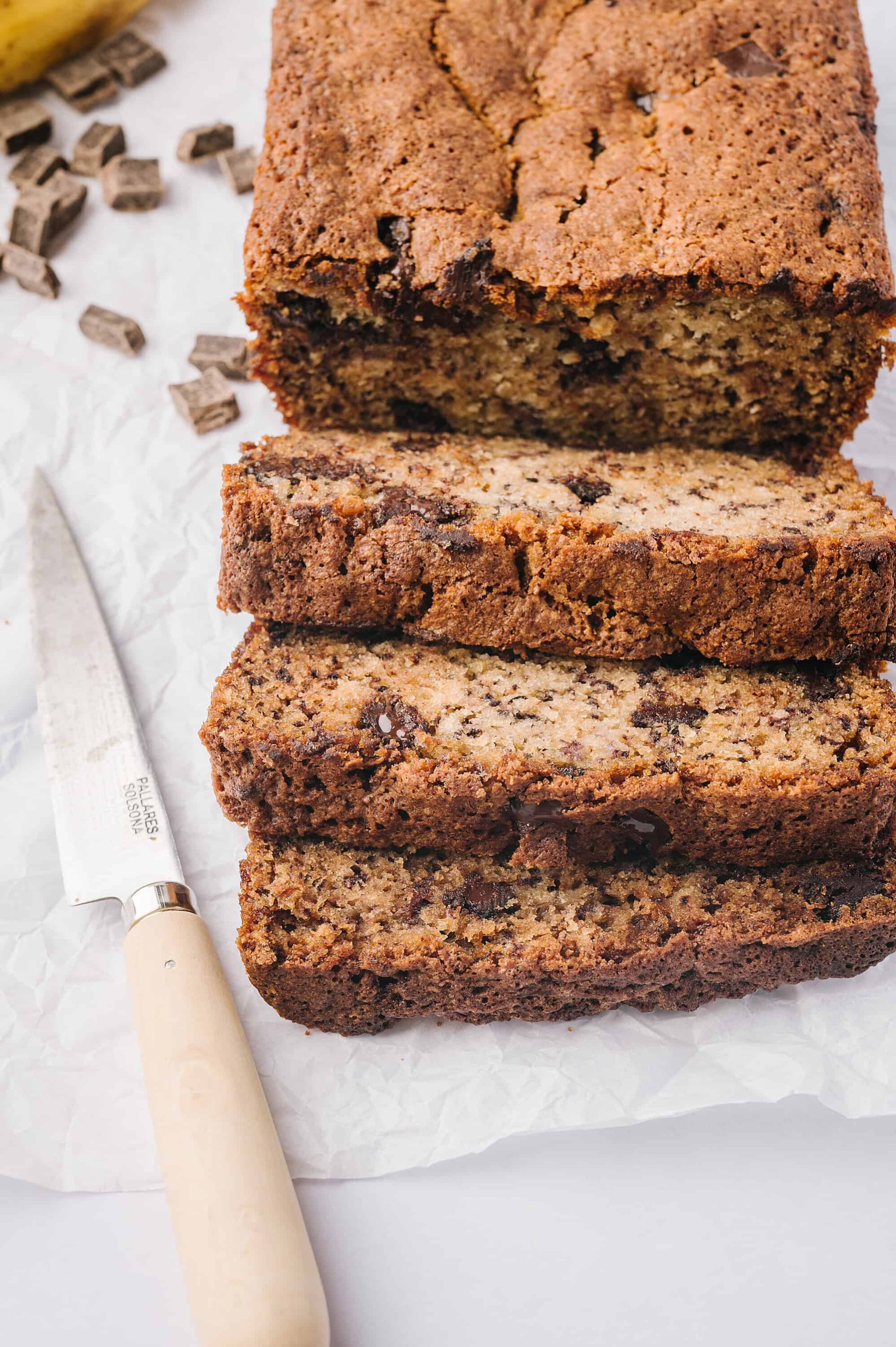 Moist chocolate chip banana bread with chunks of chocolate and walnuts. Perfect for breakfast or snacks.