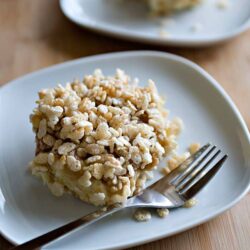 Crispy rice casserole on white plate with fork.