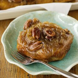 Sweet potato casserole with pecans on a green ceramic plate, baked dessert recipe, cozy fall treat, bakedbree.com.