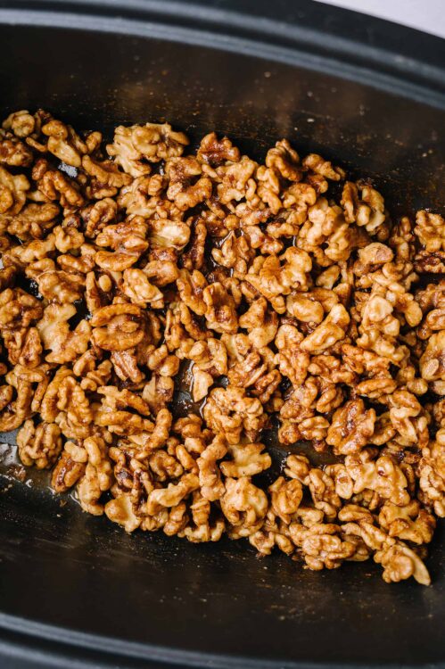 Crispy caramelized walnuts in a slow cooker for baking recipes.