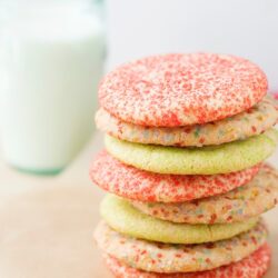 Colorful homemade sandwich cookies stacked with sprinkles and vibrant icing, perfect for baking and dessert recipes.