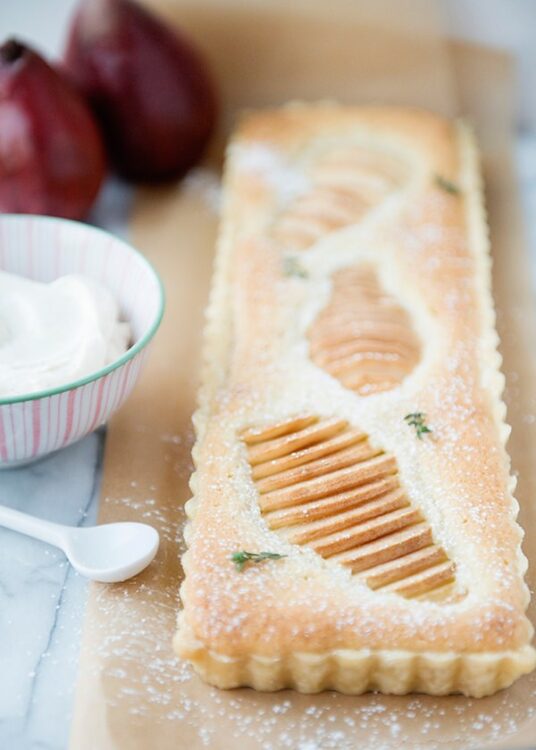 Fresh pear tart with layered caramelized pears and flaky crust, perfect for dessert or special occasions.