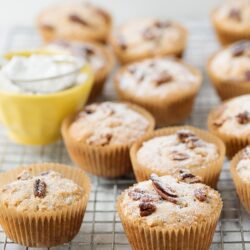 Cream Cheese Muffins with Chocolate Chips on cooling rack, homemade sweet breakfast treat.