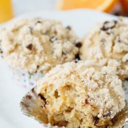 Buttery cookie crumb muffin with chocolate chips and a soft, crumbly texture for a delicious treat.