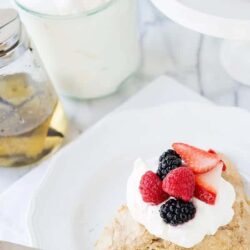 Baked Bree Fruit Tart with Fresh Berries and Cream, perfect for dessert or brunch.