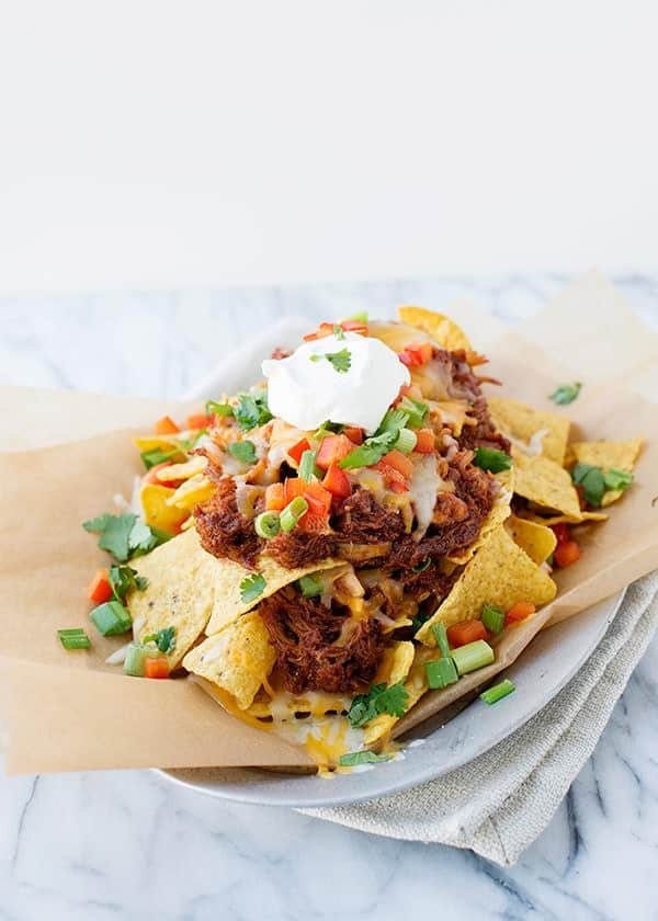 Crispy beef taco with fresh vegetables and sour cream.