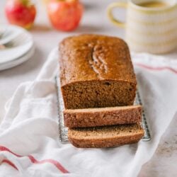 apple spice cake sliced on kitchen towel