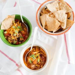 Creamy chili and tortilla chips served in colorful bowls for easy snacking and dipping. Perfect for a quick, flavorful appetizer or game day treat.