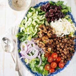 Fresh Mediterranean salad with grilled chicken, cherry tomatoes, cucumbers, olives, and feta cheese. Perfect for healthy eating.