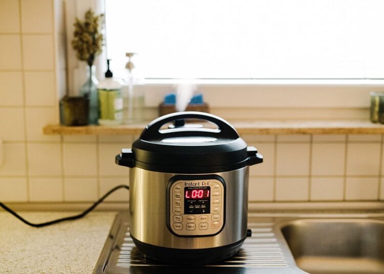 Electric pressure cooker on a kitchen counter for easy meal preparation, ideal for quick and healthy recipes.