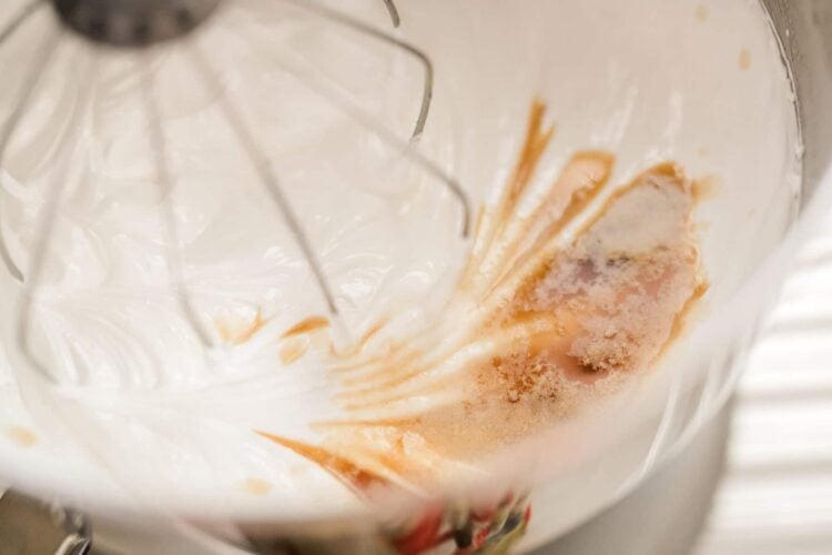 Creamy mixture in stand mixer for baking recipes, close-up of baking batter in mixer bowl, Baked Bree style baking process, rich textured batter for homemade baked goods, relevance.