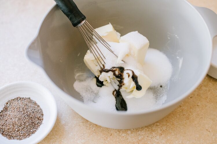 Butter, sugar, vanilla, chocolate, mixing ingredients for baking in a white bowl, baking at Baked Bree.