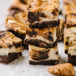 Rich cookie dough and chocolate brownie layered dessert squares.