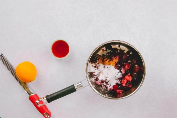 Fresh mixed berries in a saucepan for berry compote or jam.