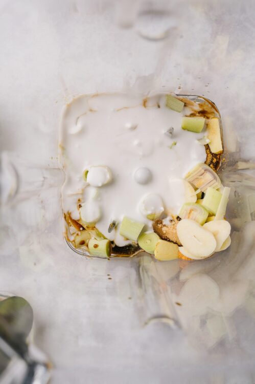 Creamy vegetable soup ingredients in a blender, ready to blend for a healthy, delicious recipe.