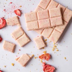 Creamy strawberry white chocolate bark with dried strawberries and crushed cookie crumbs. Perfect for spring desserts.