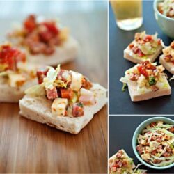 Baked Brie topped with diced ham and vegetables on rustic bread slices, perfect appetizer.