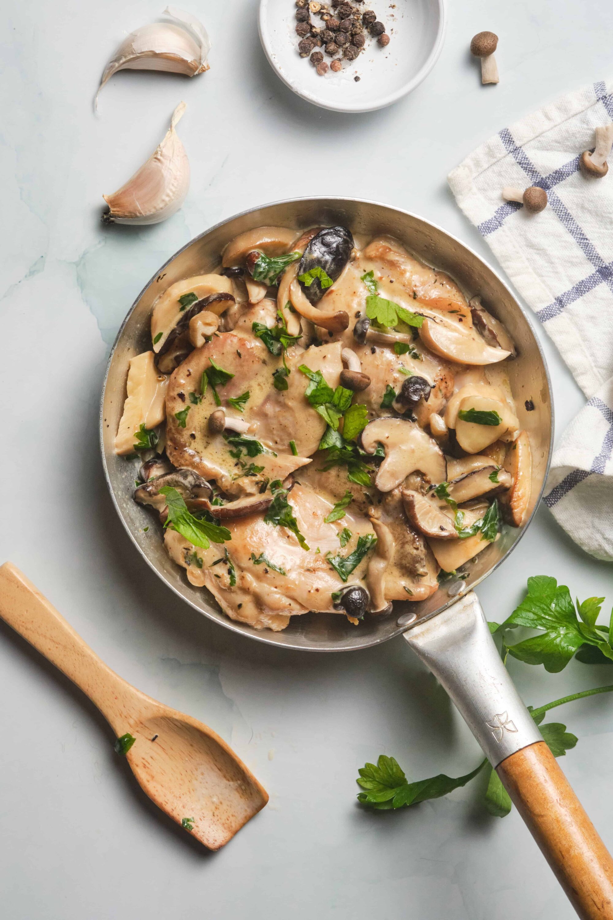Creamy mushroom chicken skillet with herbs and garlic, cooked to perfection for a delicious meal.