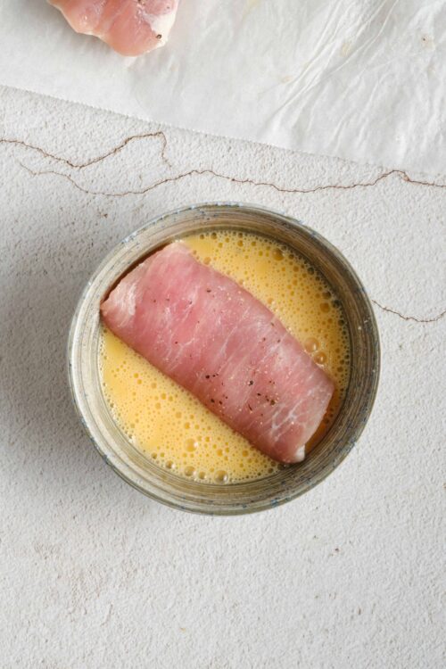 Baked Bree's recipe: bacon soaking in beaten eggs for delicious breakfast or brunch dishes.