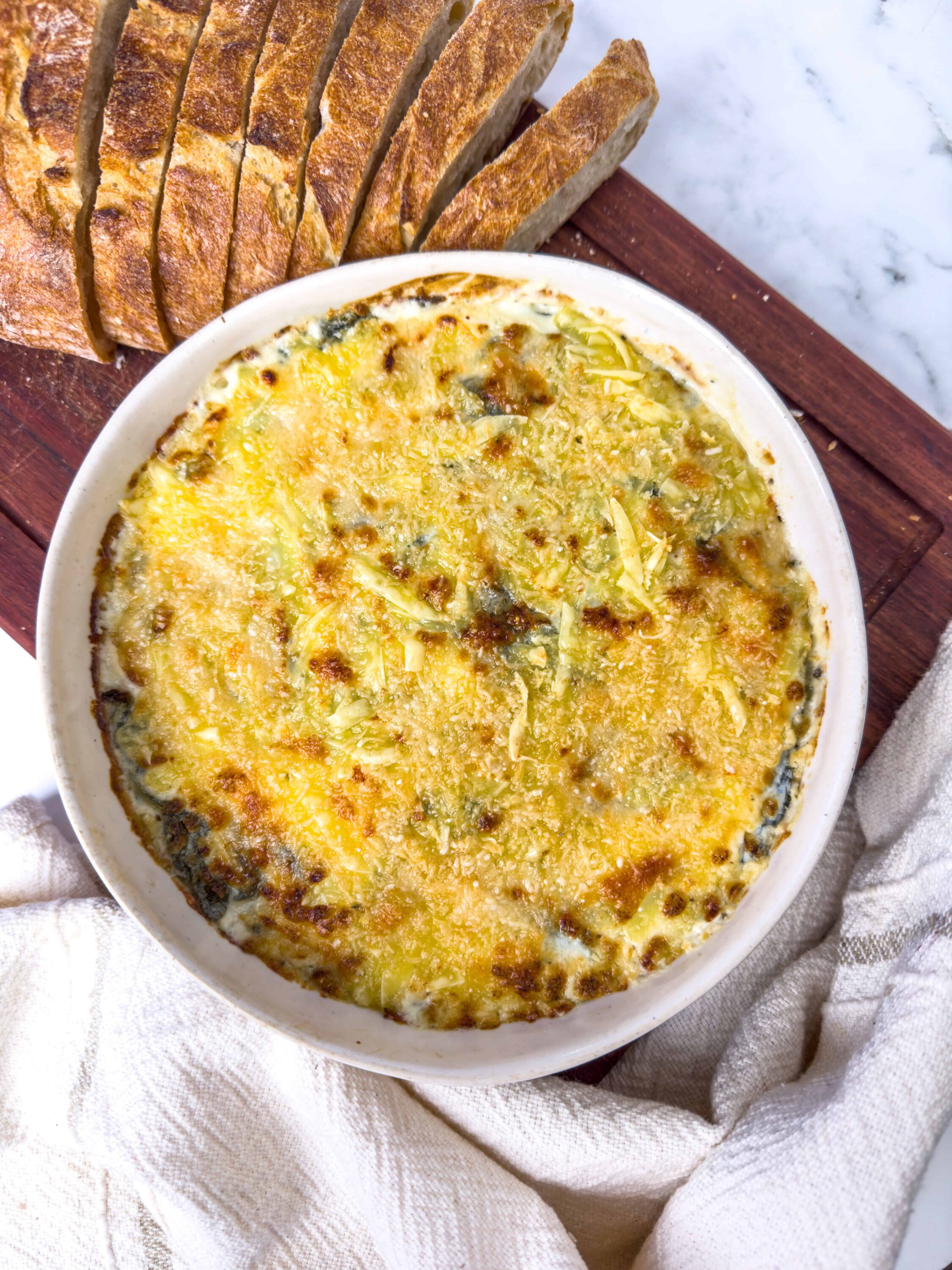 Creamy vegetable baked casserole with melted cheese, perfect comfort food.