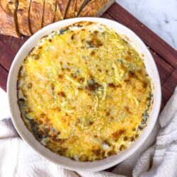Creamy vegetable baked casserole with melted cheese, perfect comfort food.