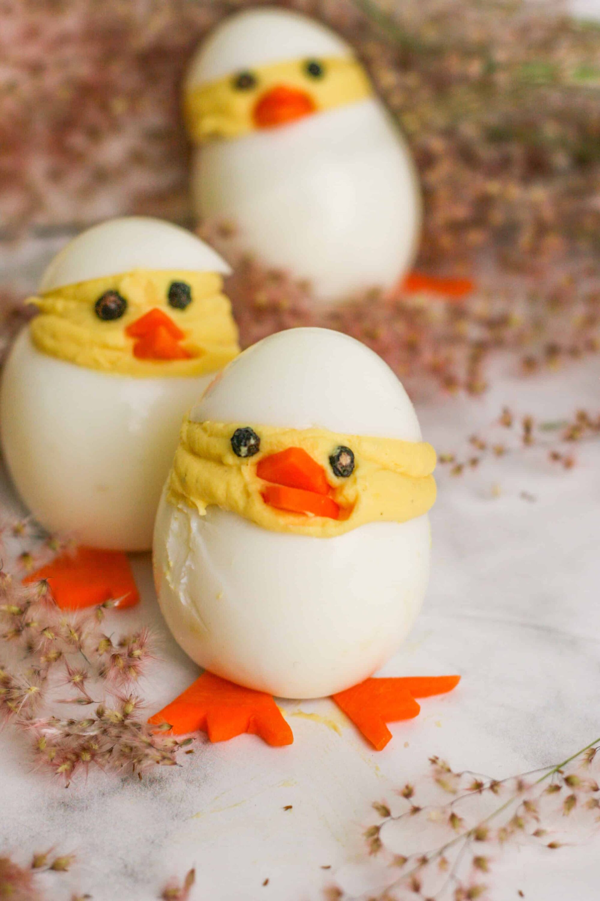 Boiled eggs decorated as adorable chick Easter eggs for spring or Easter celebrations.