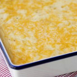 Creamy cheesy casserole baked to golden perfection with melted cheese topping.
