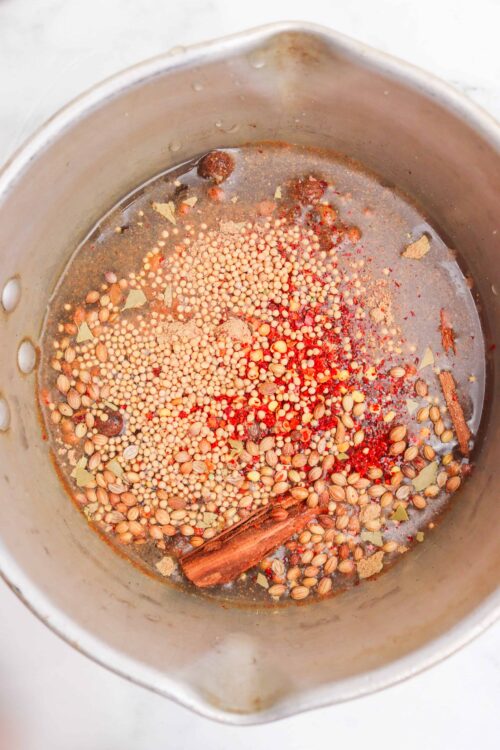 Dried spices and herbs in a pot for cooking or baking.
