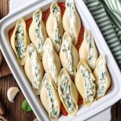 Creamy blue cheese stuffed pasta shells baked with marinara sauce. Perfect comfort food recipe from Baked Bree.