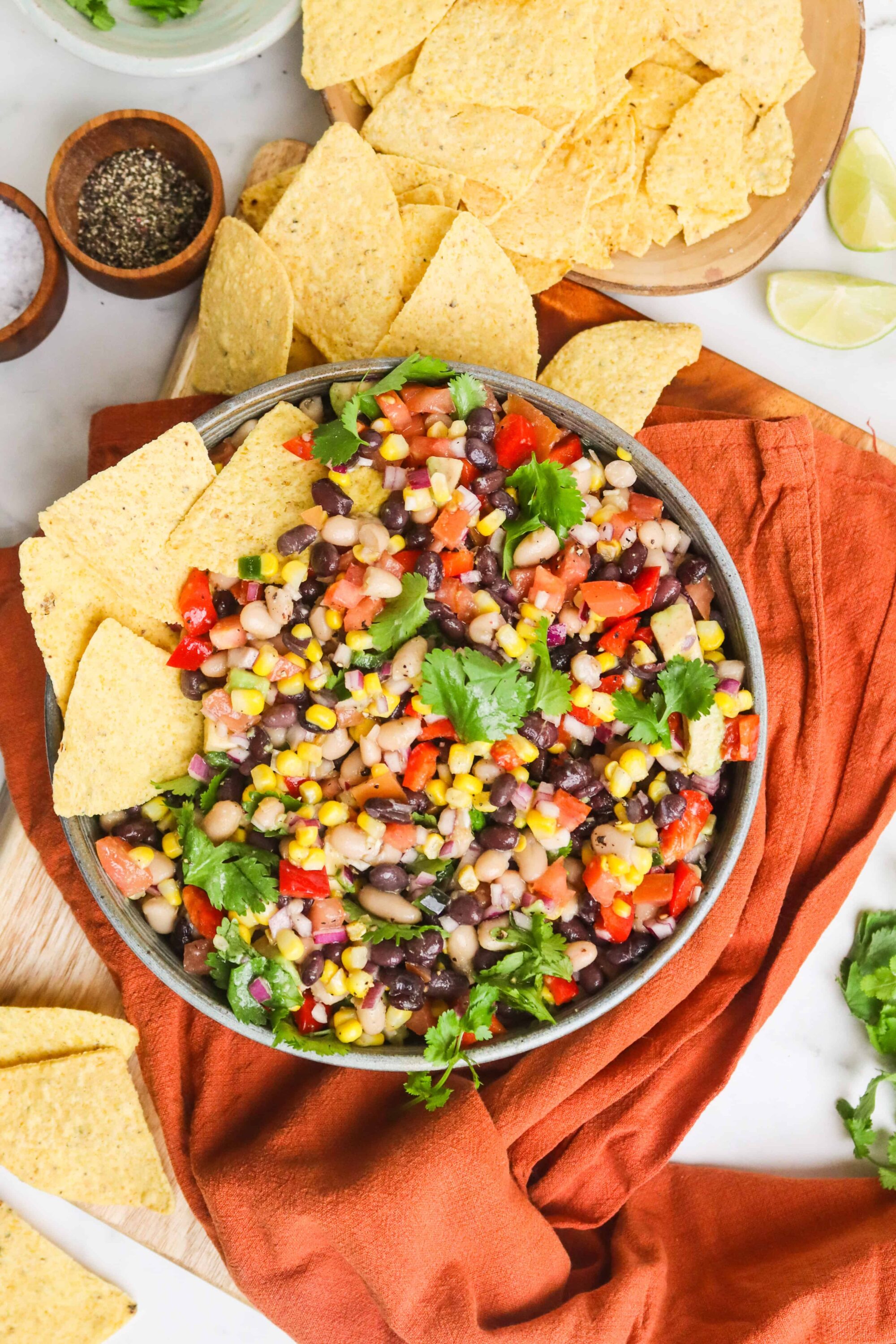 Fresh Mexican black bean salsa with colorful vegetables and cilantro, served with tortilla chips.