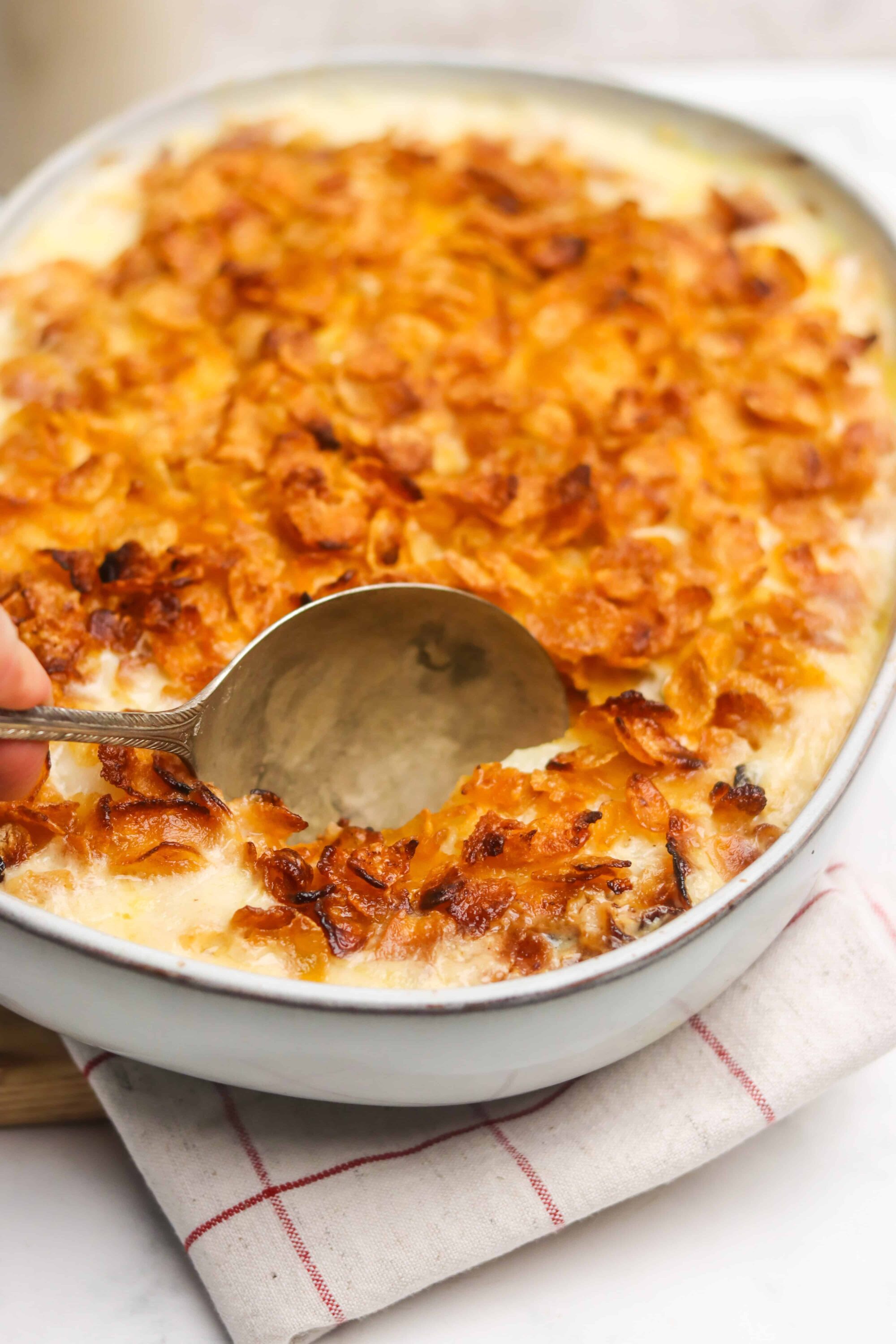 Creamy baked chicken casserole with crispy onion topping, perfect comfort food recipe.