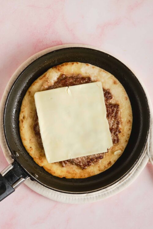 Buttermilk biscuit crust with beef and cheese for homemade pizza.