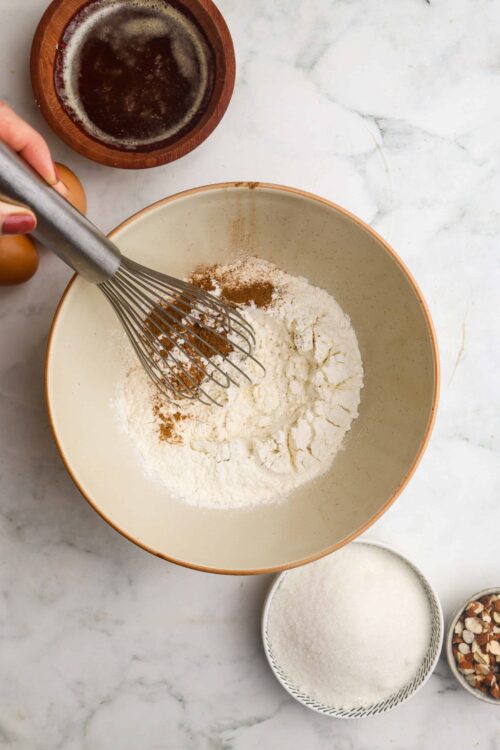 Flour and cocoa powder mixture for baking on marble countertop.