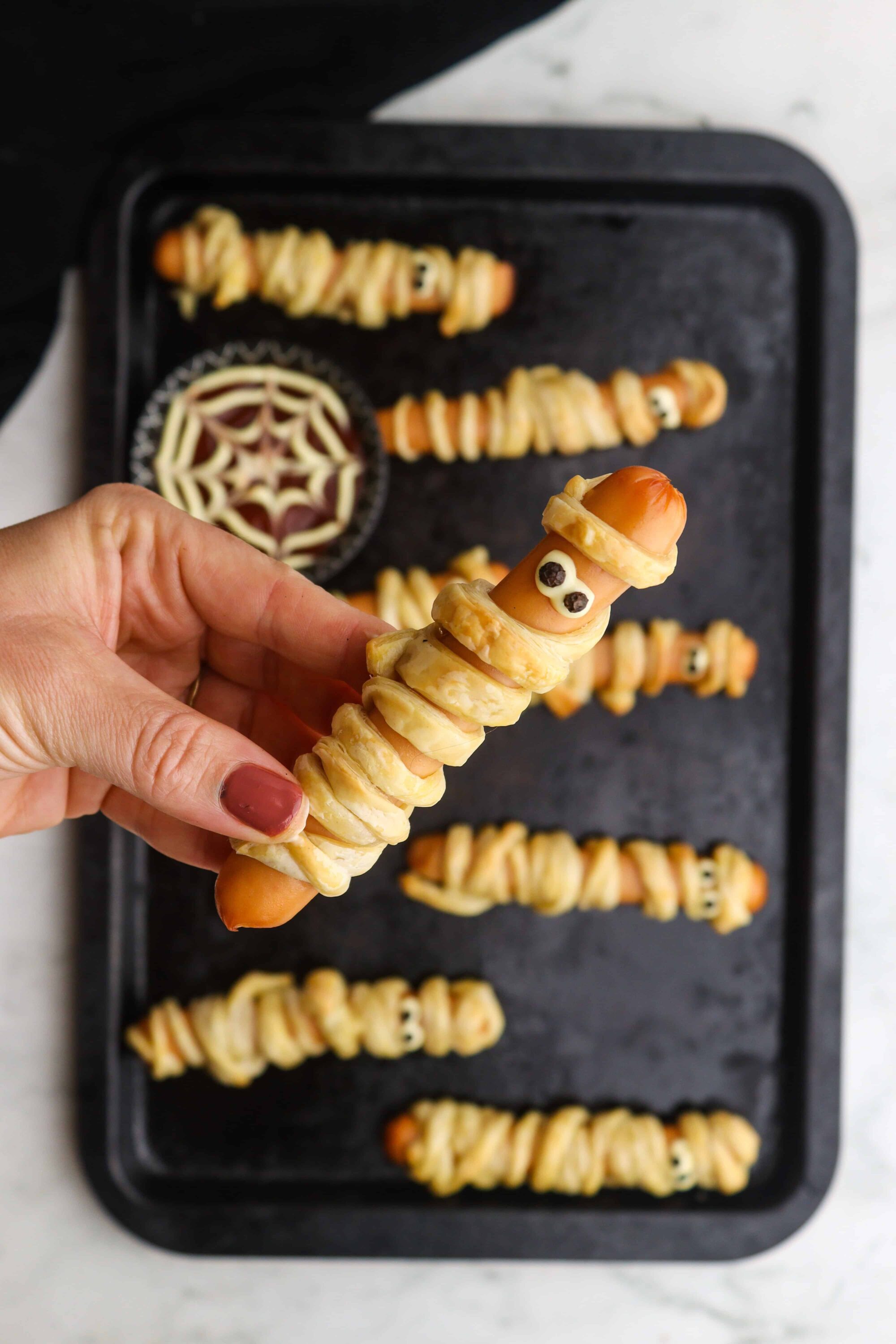 Spider Web Puff Pastry Treats with Eyeball Candies and Creepy Dessert Halloween Baked Bree.