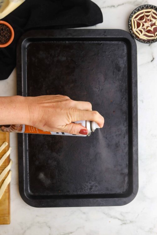 Spray baking sheet with cooking spray.