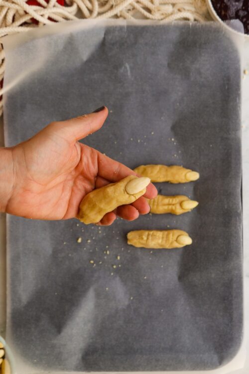 Fresh ginger turmeric healing shots on parchment paper.
