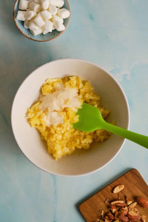 Creamy mashed potatoes with cheese and marshmallows for comforting baked treats.