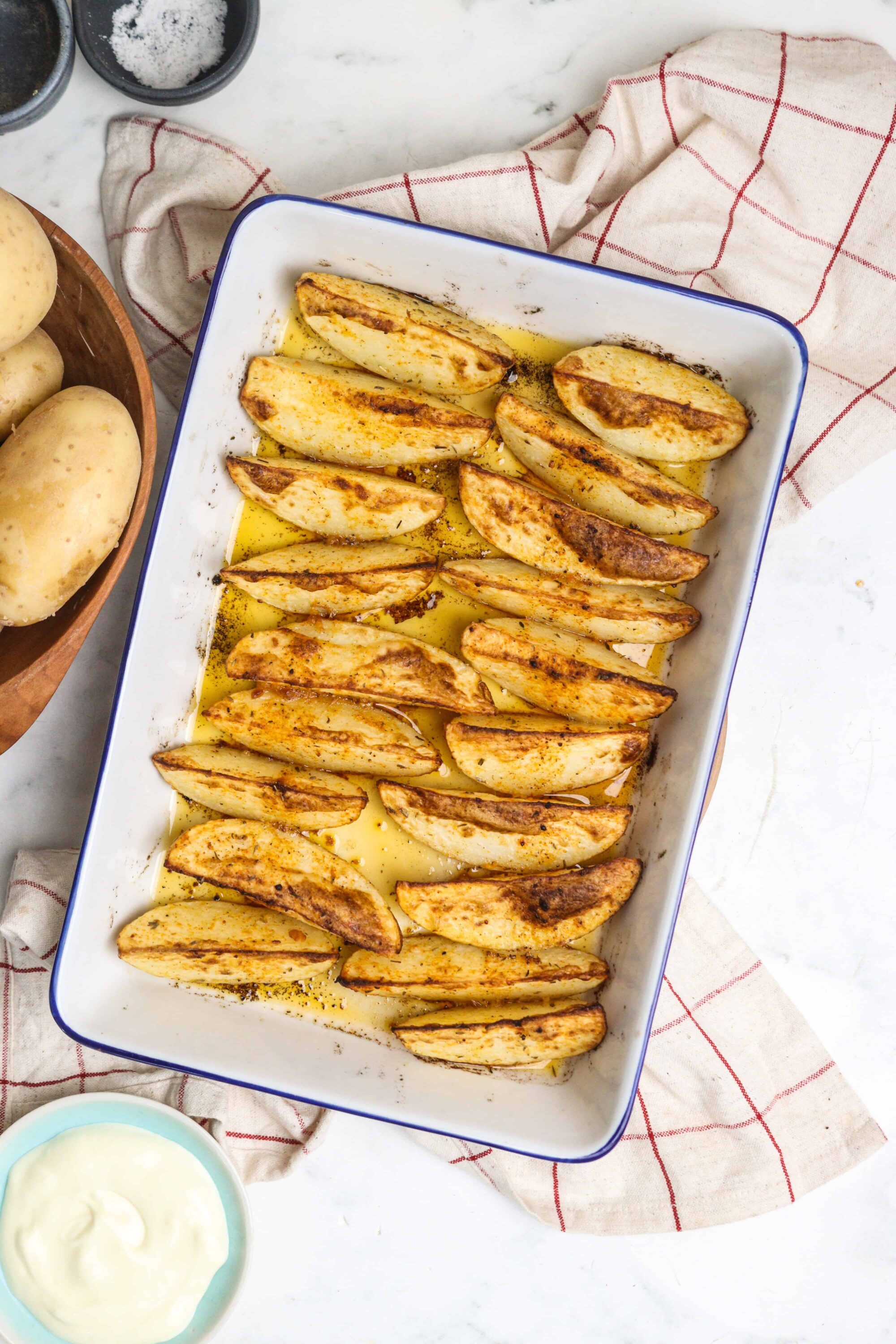 Golden roasted potato wedges seasoned with paprika and herbs.