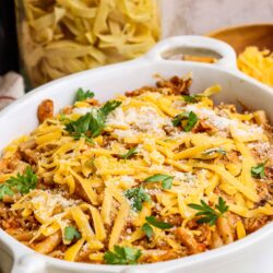 Creamy Baked Ziti with ricotta and mozzarella cheese in a white baking dish.