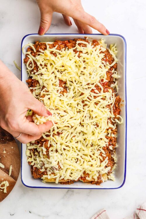 Creamy baked Ziti with melted cheese and rich tomato sauce, ready for oven baking. Perfect comfort food recipe for family dinner.