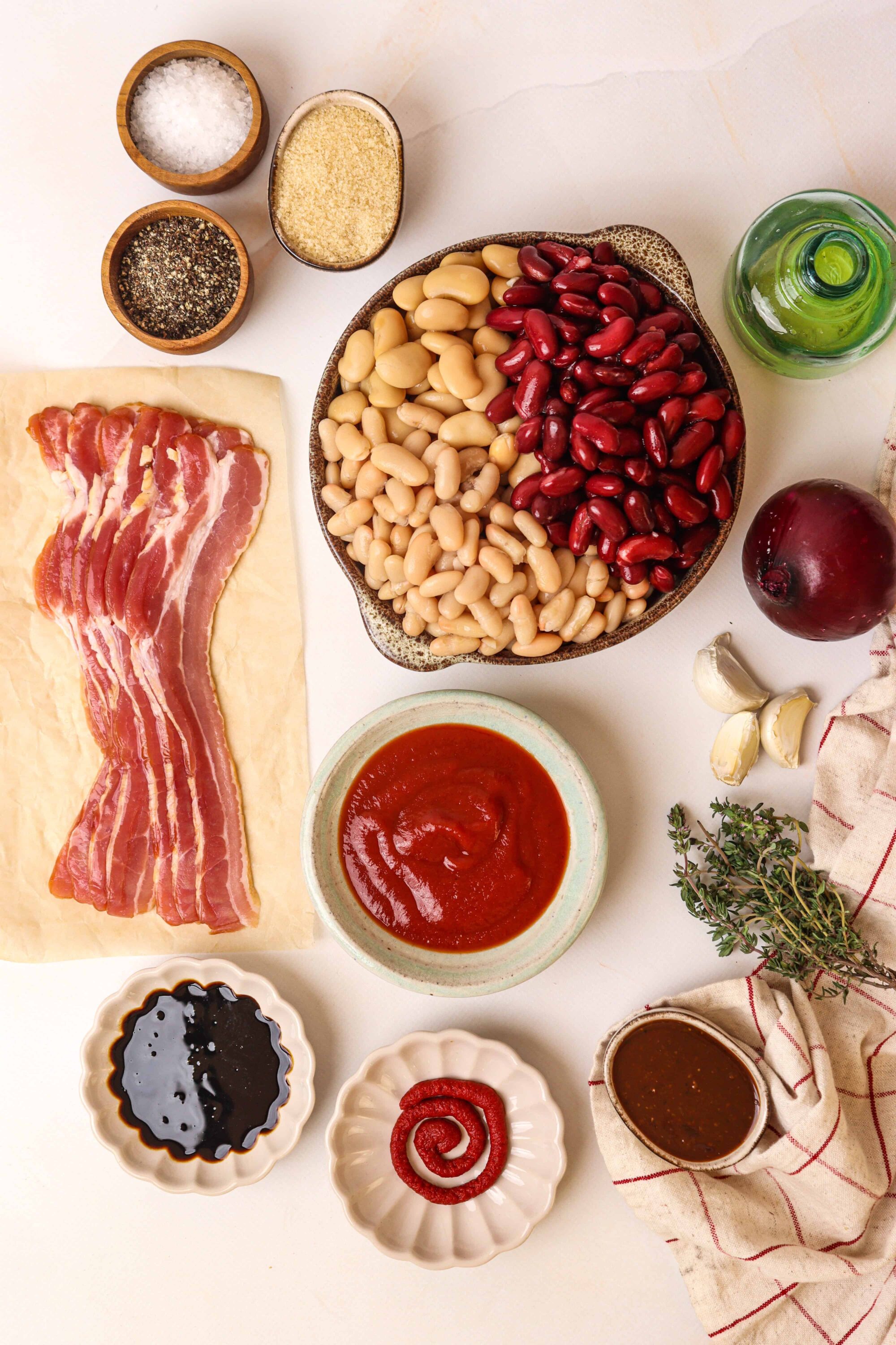 Brightly colored beans, bacon, garlic, and spices for easy baked bean recipe. Healthy, flavorful, and perfect for family dinners or gatherings.