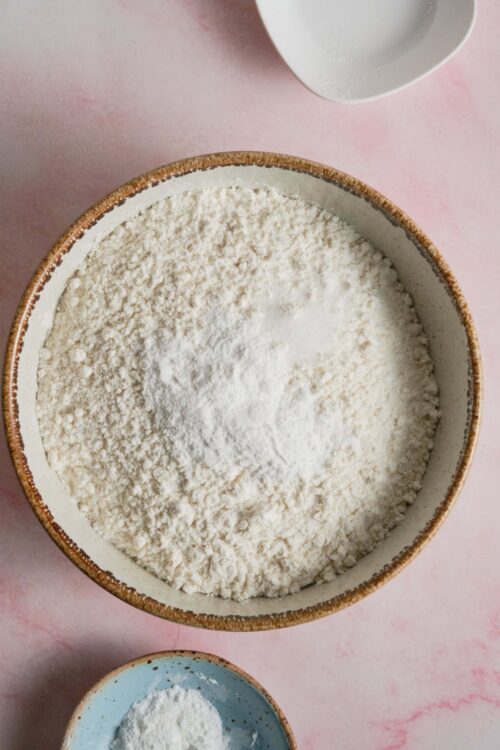 Flour in a ceramic bowl for baking and pastry making.