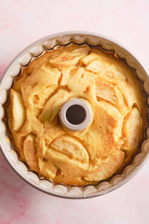 Creamy homemade apple bread pudding in bundt pan, baked with fresh apples and cinnamon. Perfect for fall desserts.