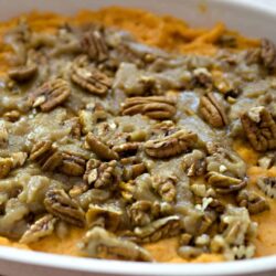 Creamy sweet potato casserole topped with pecans, perfect for holiday family dinners.