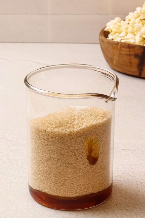 Sweetened condensed milk in a glass jar for baking recipes.