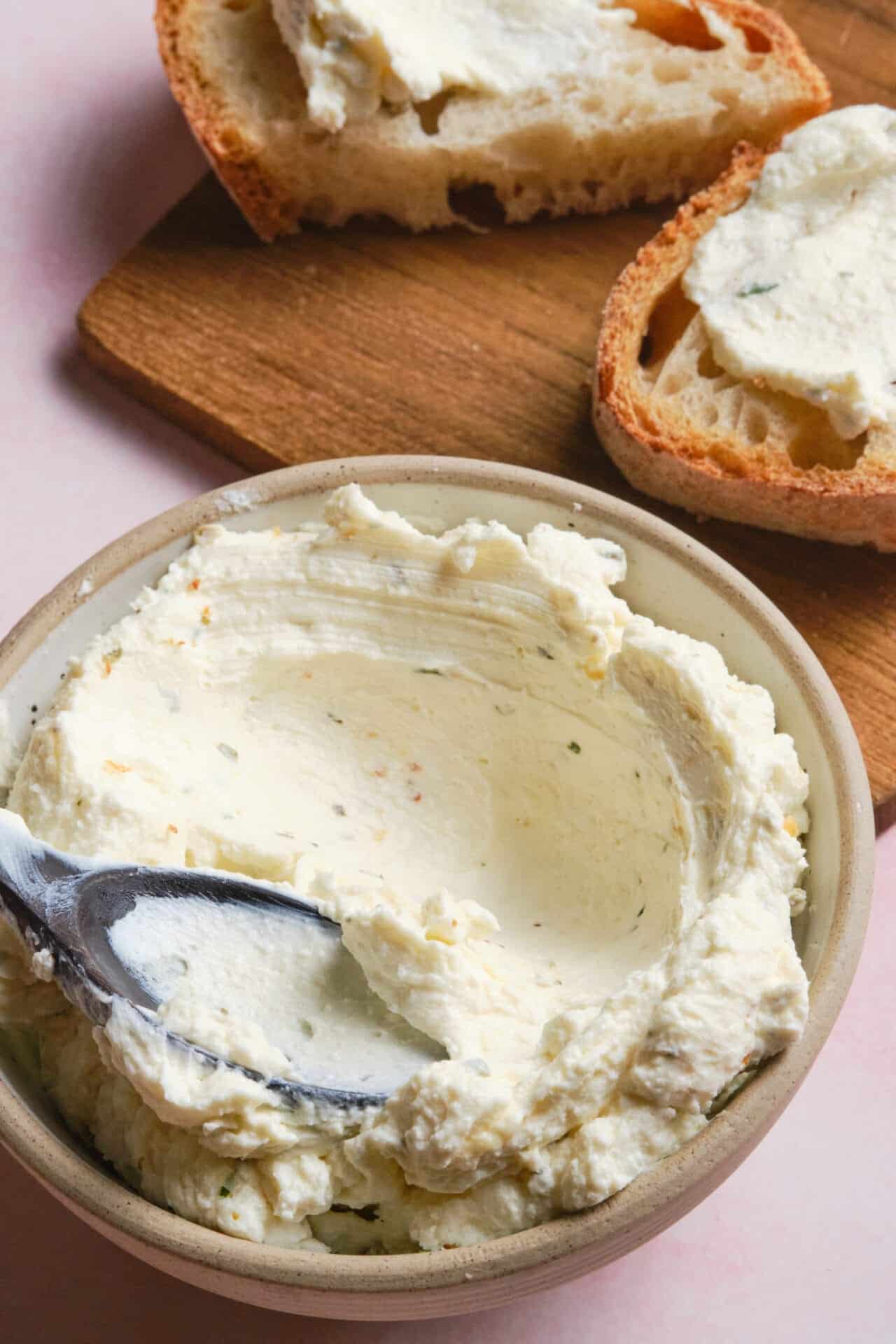 Cream cheese butter spread for bread, close-up of seasoned whipped cream cheese in bowl.
